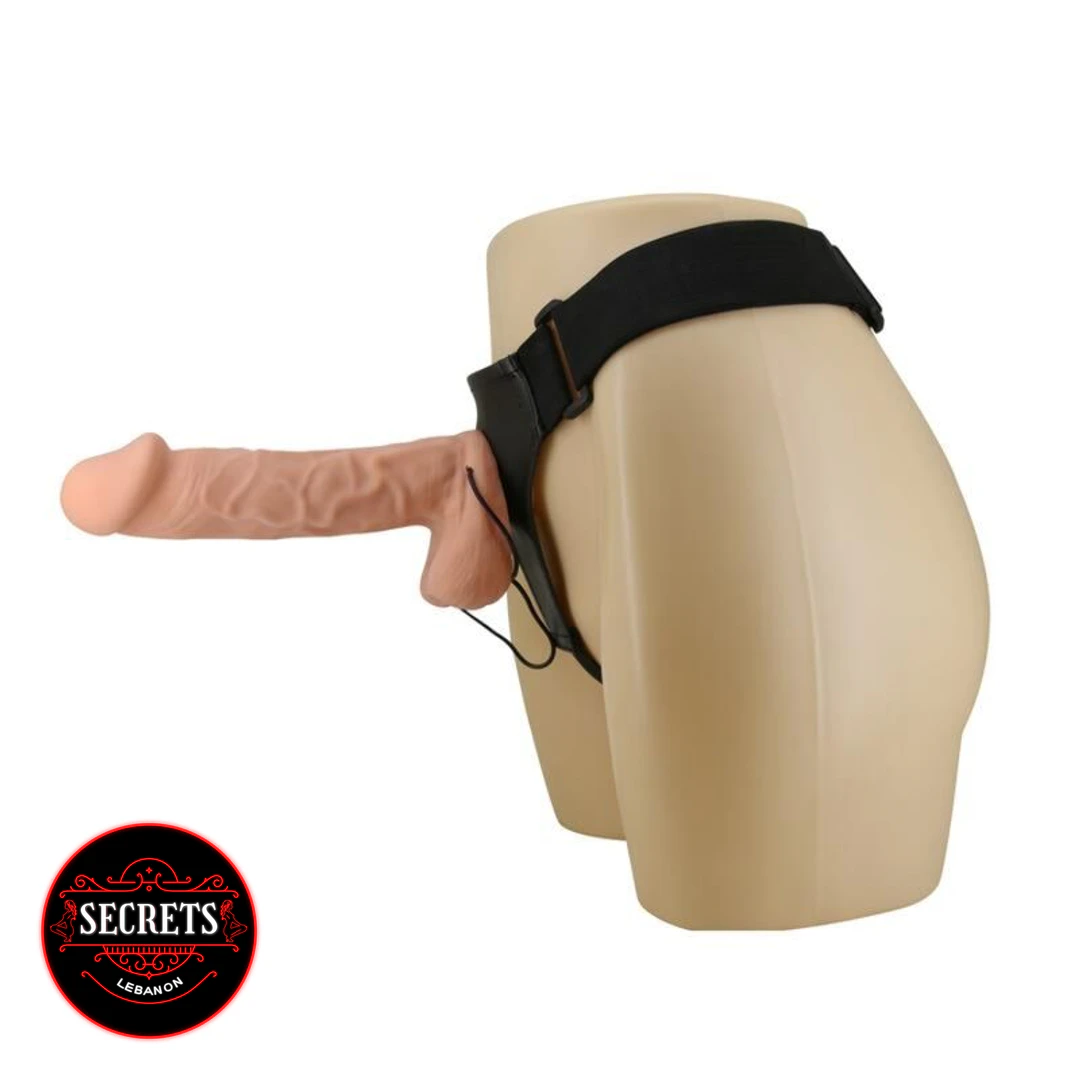 Close-up detail of the 10 Inch Vibrating Strap On Dildo tip and textured shaft surface