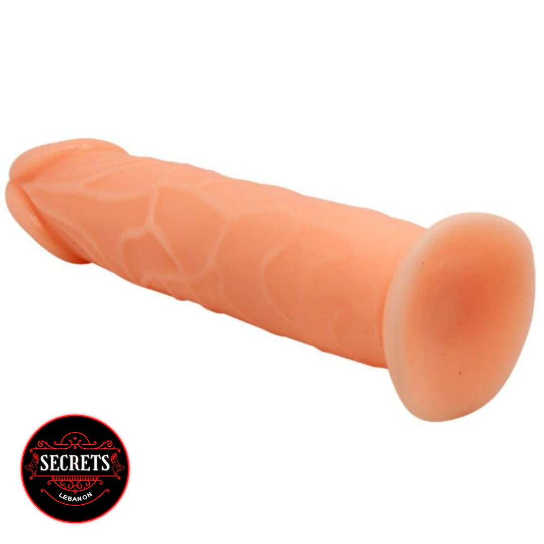 20cm Veiny Dildo in flesh tone shown diagonally with suction cup base