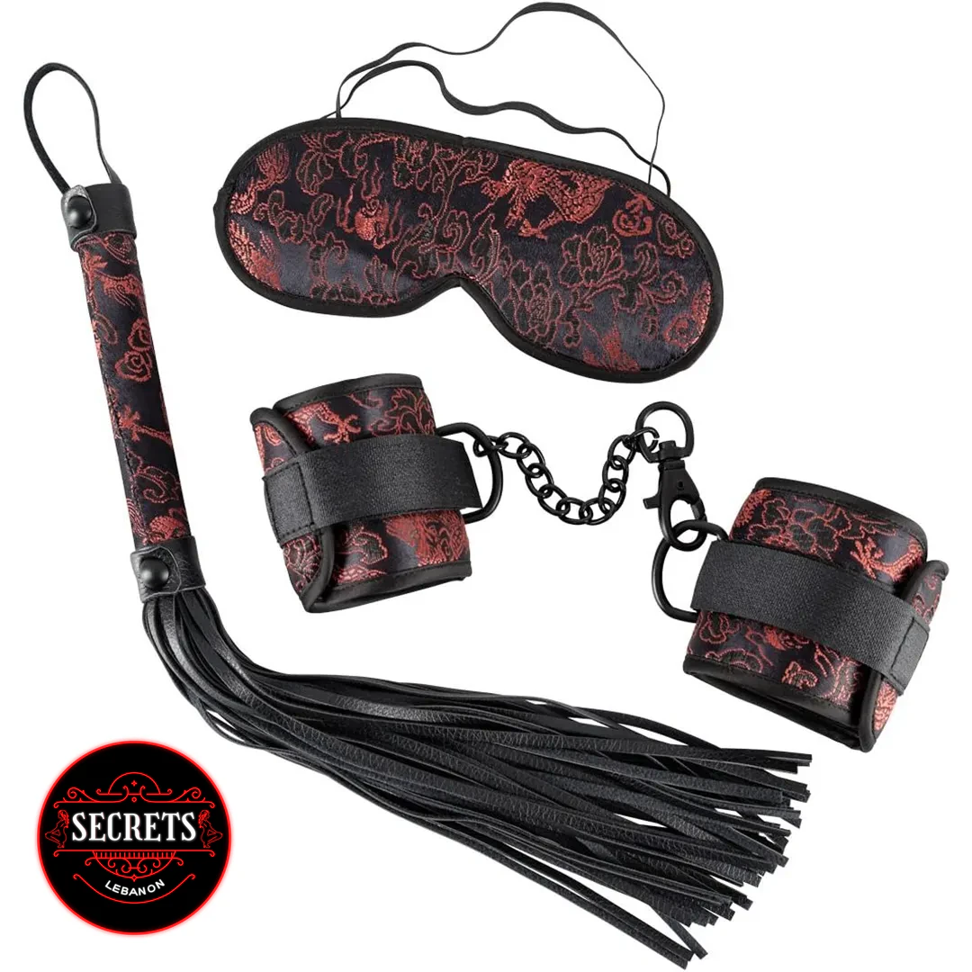 3 Piece Brocade BDSM Kit with flogger, cuffs, and blindfold in black-red