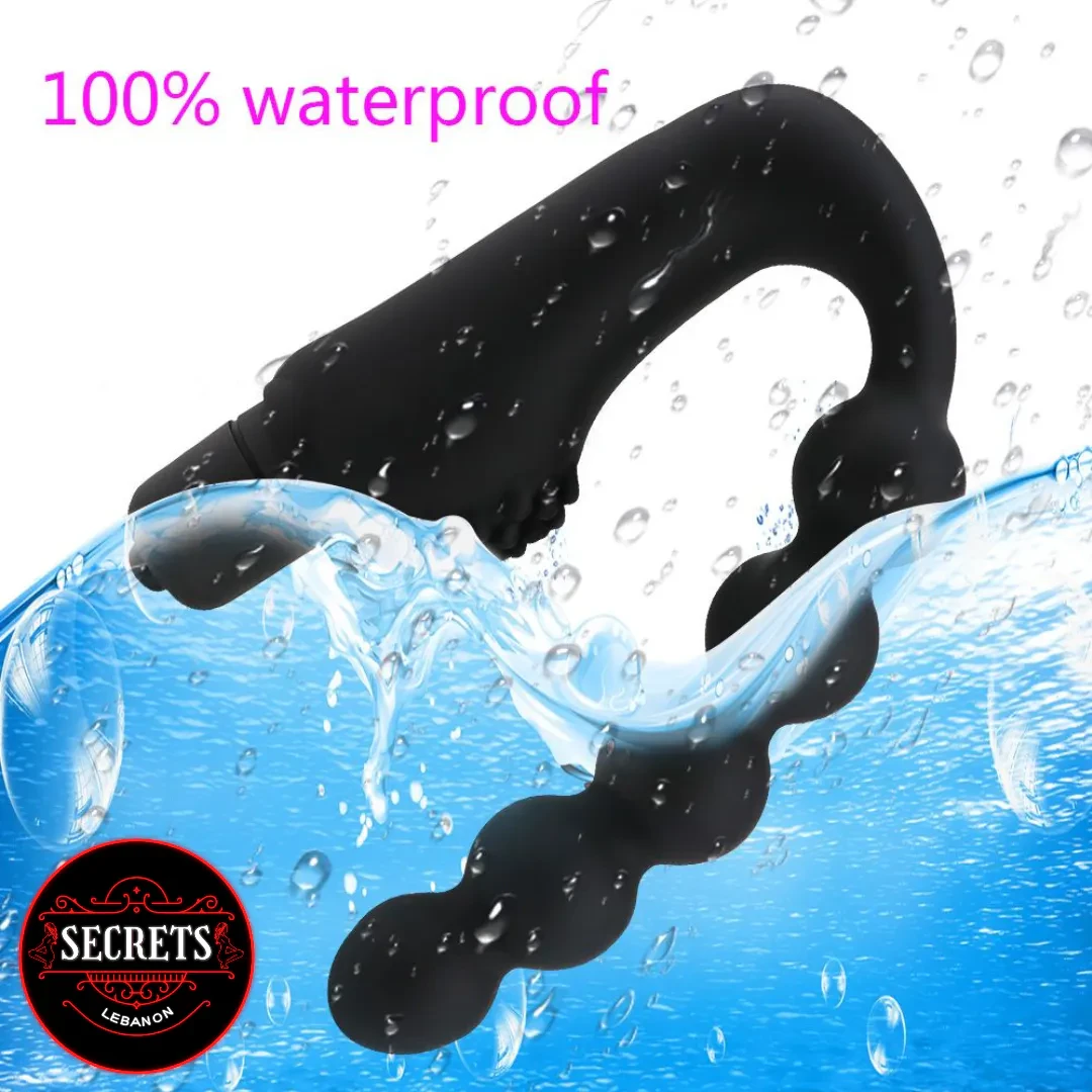 7 Bead Anal Prostate Vibrator black silicone submerged in splashing water