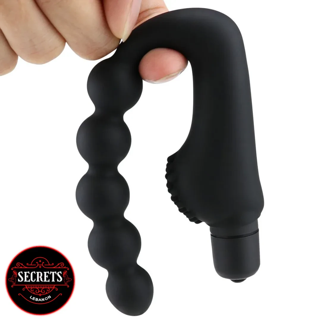 7 Bead Anal Prostate Vibrator held by hand showing black silicone beads