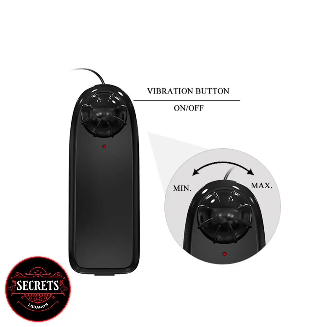 Baile Ultra Dual Penis Strap-On black wired controller with vibration button close-up