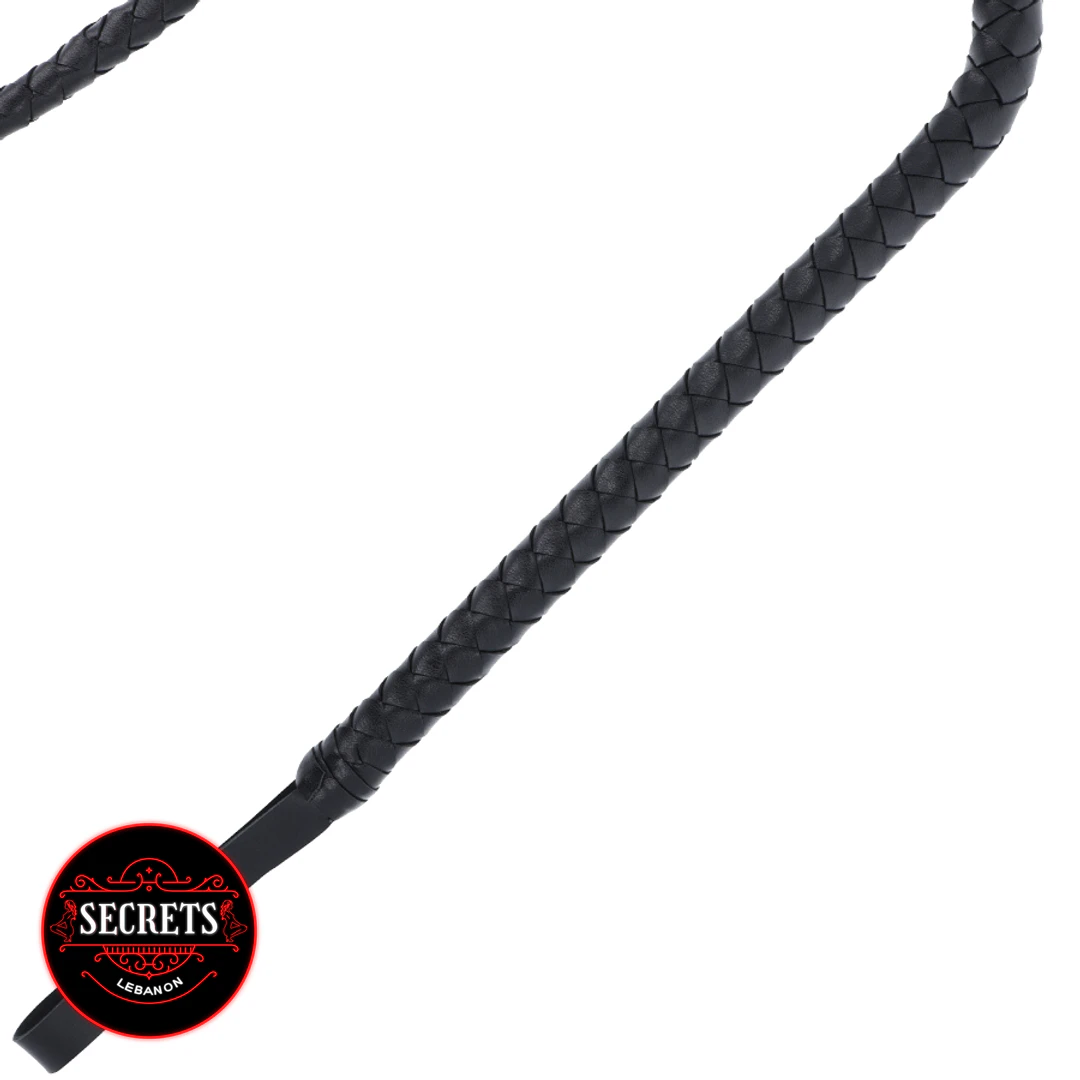Dominatrix Braided Leather Whip close-up showing black woven texture on white background
