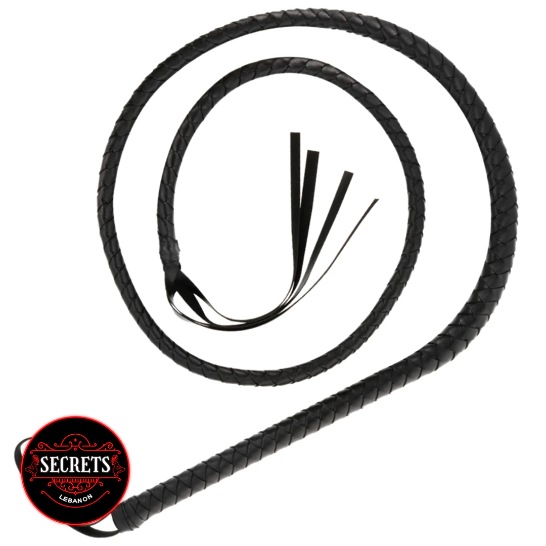 Dominatrix Braided Leather Whip coiled in black with tassel tip
