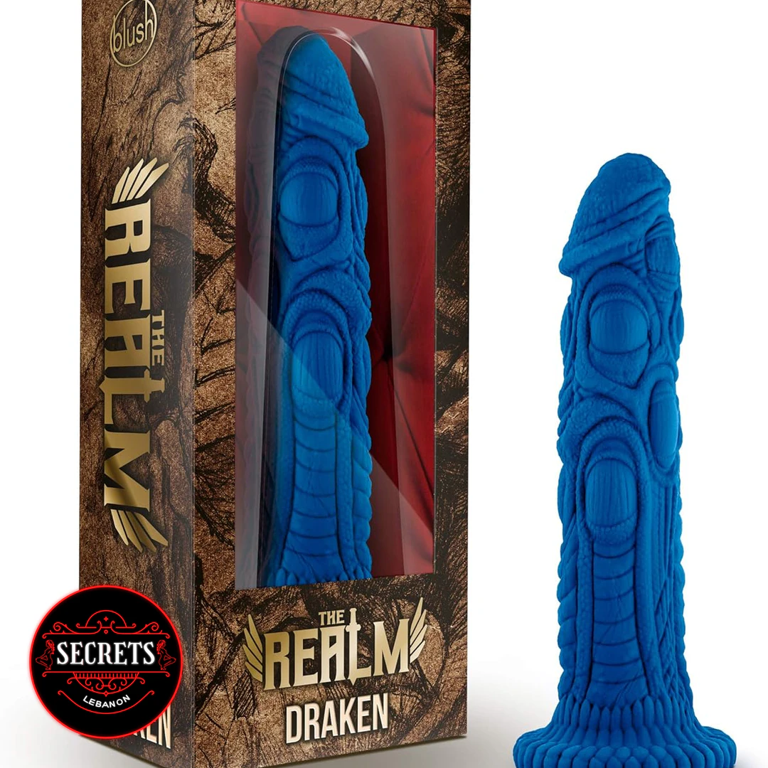 Draken Fantasy Silicone Dildo in blue with dragon-textured surface beside retail box