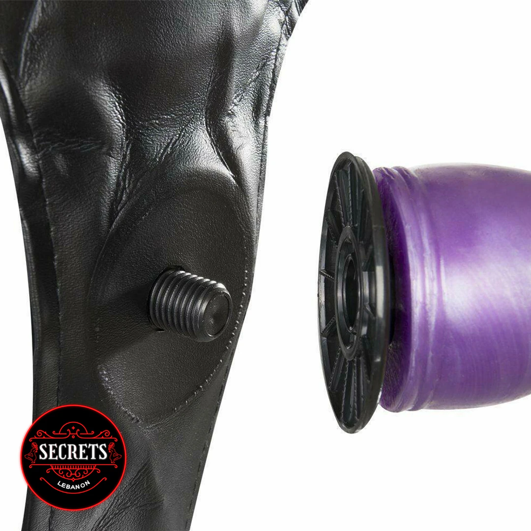 Dual Ribbed Double Strapon close-up showing black harness screw and purple base
