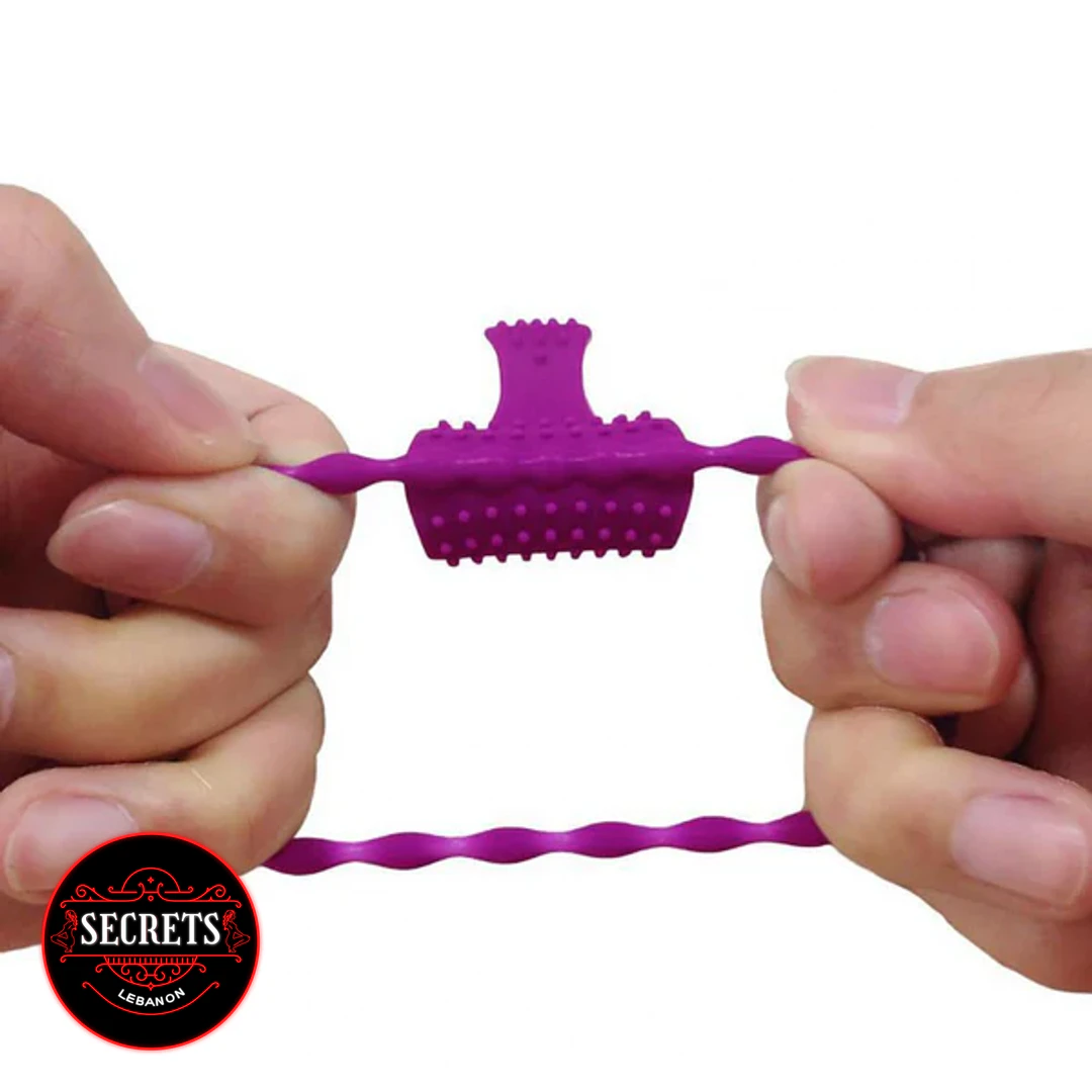 Dual Stimulation Beaded Silicone Ring stretched by two hands showing purple textured centre