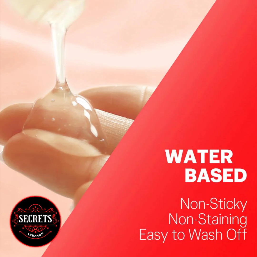Durex Strawberry Flavored Lubricant 50ml water-based gel stretching between fingers close-up