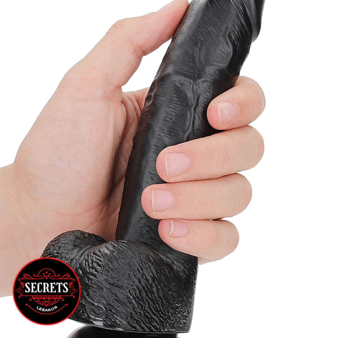 FlexCore Suction Base Dildo black realistic textured shaft held in hand