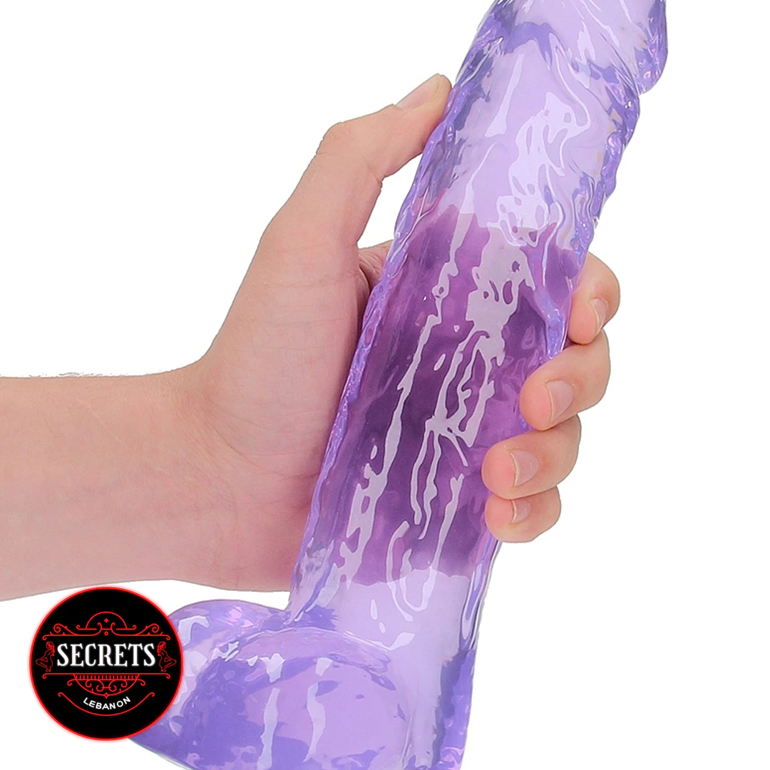 FlexCore Suction Base Dildo held in hand showing purple marbled jelly texture