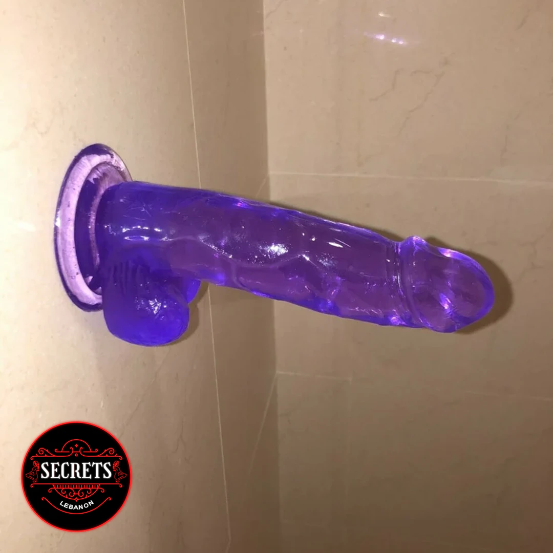 FlexCore Suction Base Dildo mounted on tiled wall purple translucent jelly
