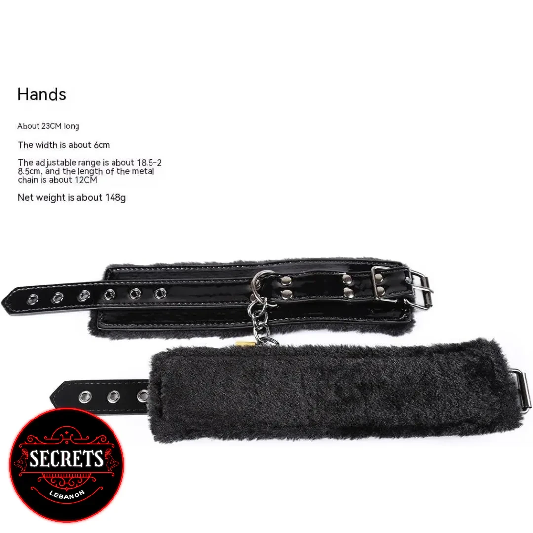 Locking Fur Wrist Restraints in black patent leather with silver chain connector