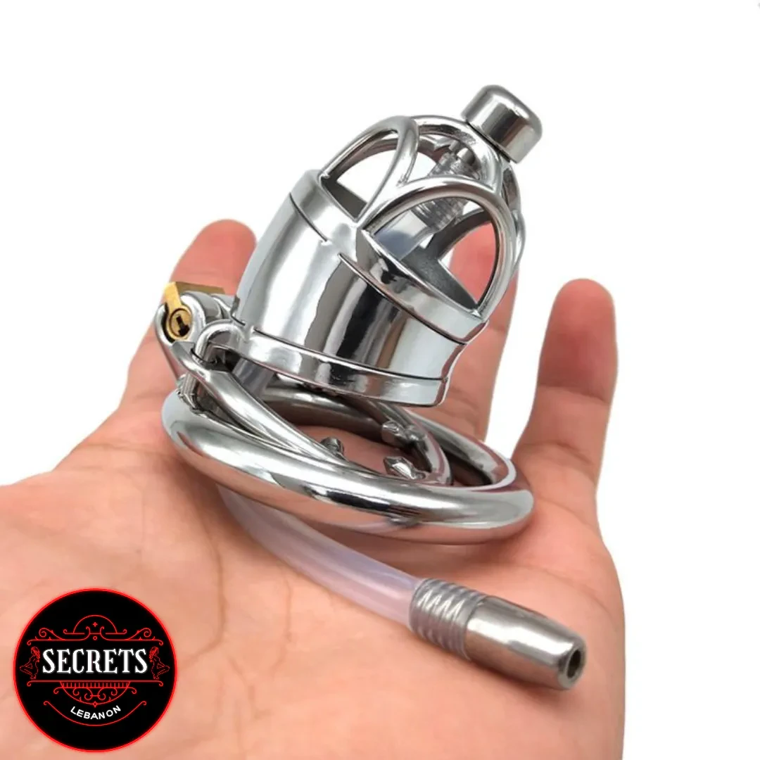 MetalChastityWithCatheter-3 Metal Chastity With Catheter in polished stainless steel held in a hand