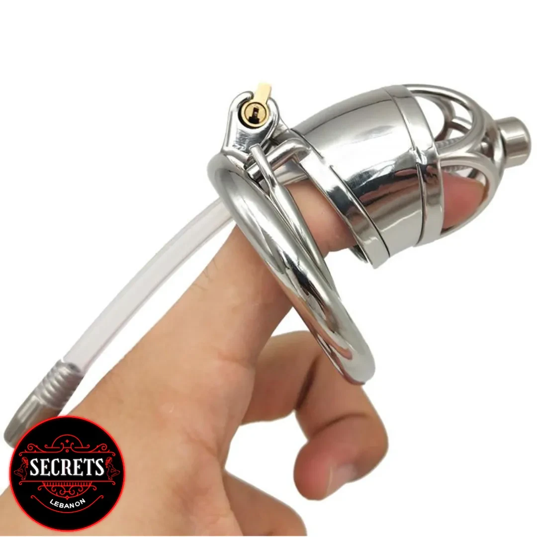 Metal Chastity With Catheter held in hand showing polished steel cage
