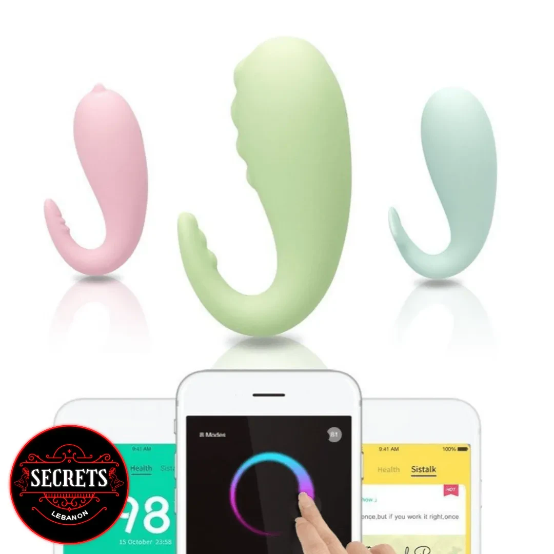 Monster Pup Whale App Controlled Vibrator in pink green and blue silicone with smartphone