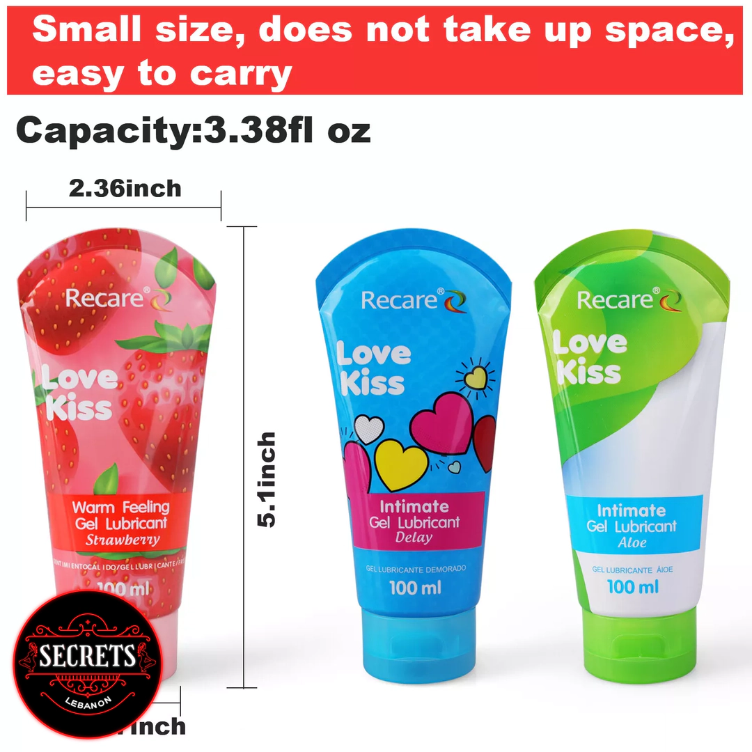 Recare Warm Feeling Strawberry Lubricant 100ml tube surrounded by fresh strawberries
