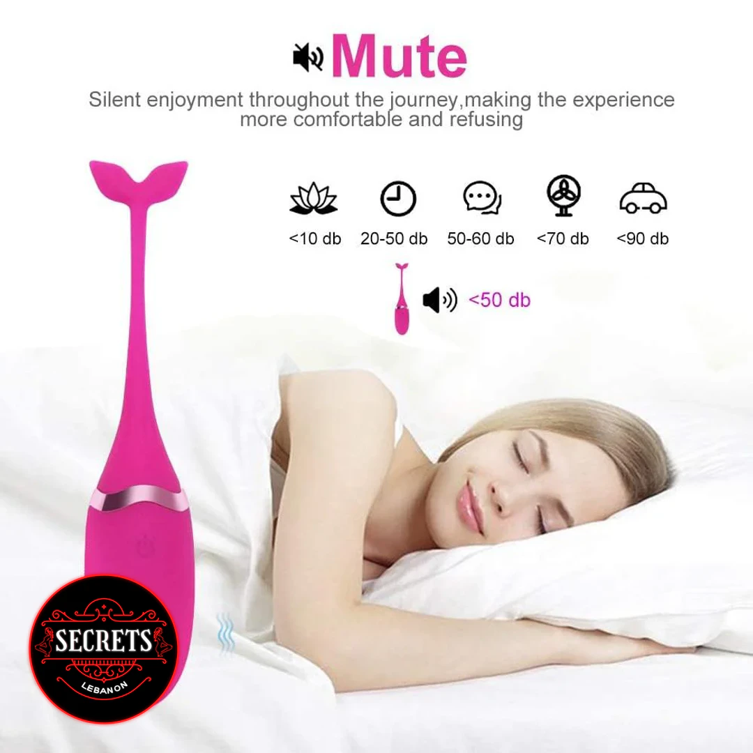 Remote Control Egg Vibrator in hot pink whale shape beside sleeping woman