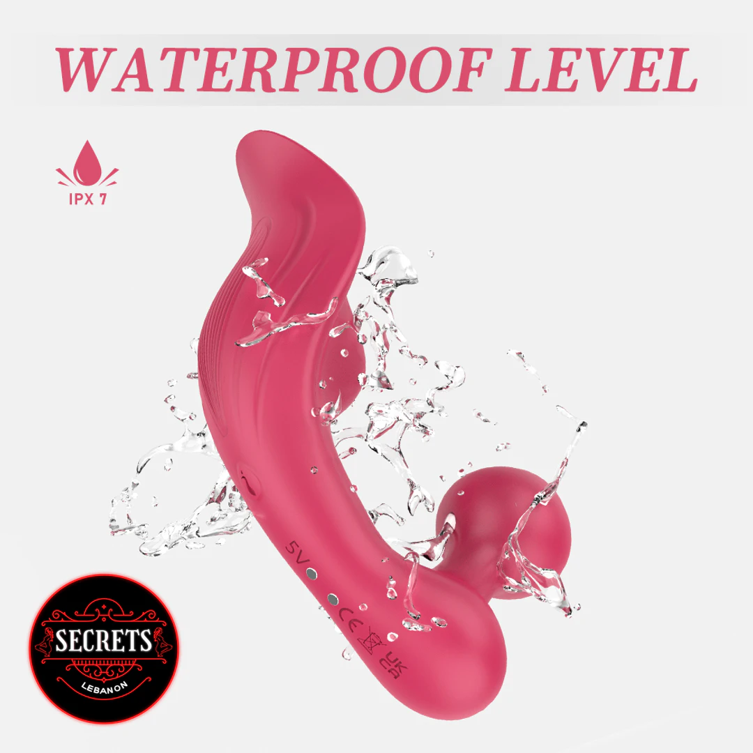 S-Hande Chomper Dual Vibrator in pink with water splashes showing IPX7 waterproofing