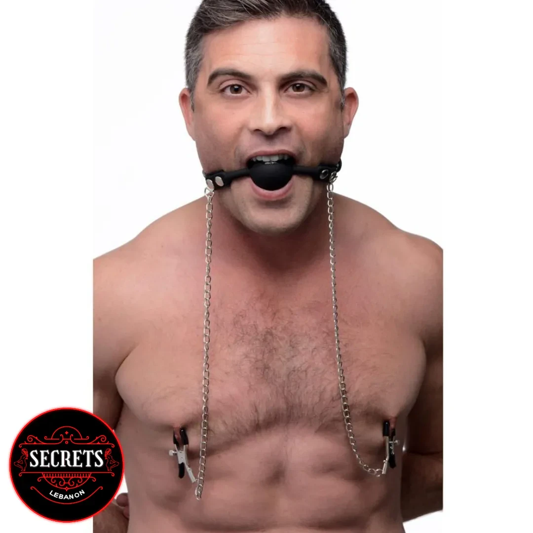 Silicone Ball Gag With Nipple Clamps worn by shirtless male model