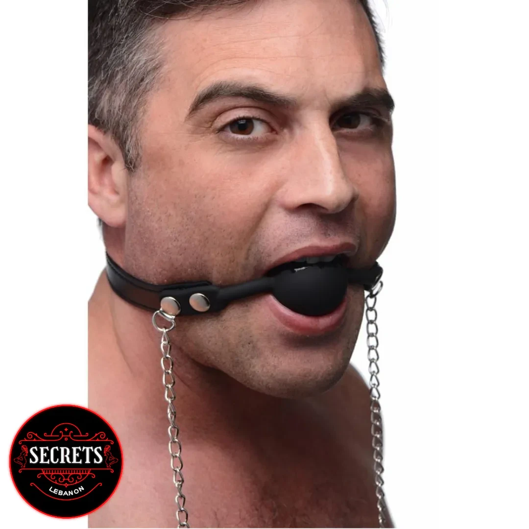 Silicone Ball Gag With Nipple Clamps worn by male model with silver chains