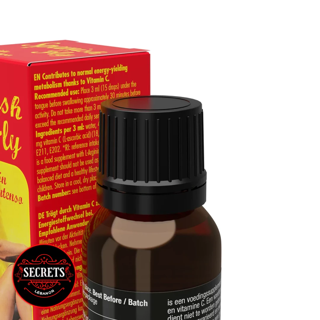 Spanish Fly Arousal Drops amber bottle close-up beside red product box