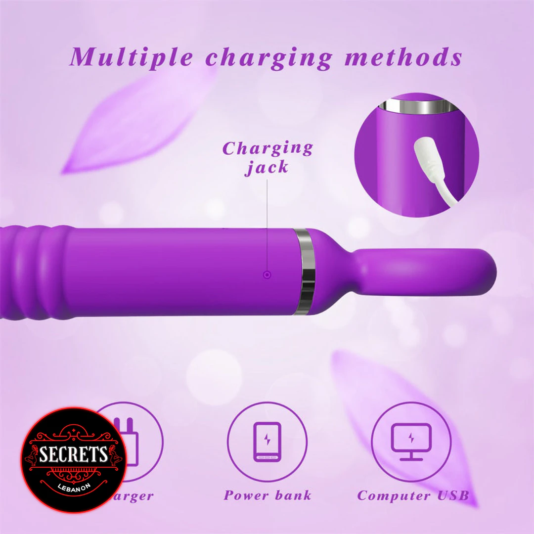 Thrusting Silicone Wand Vibrator in purple showing USB charging jack detail