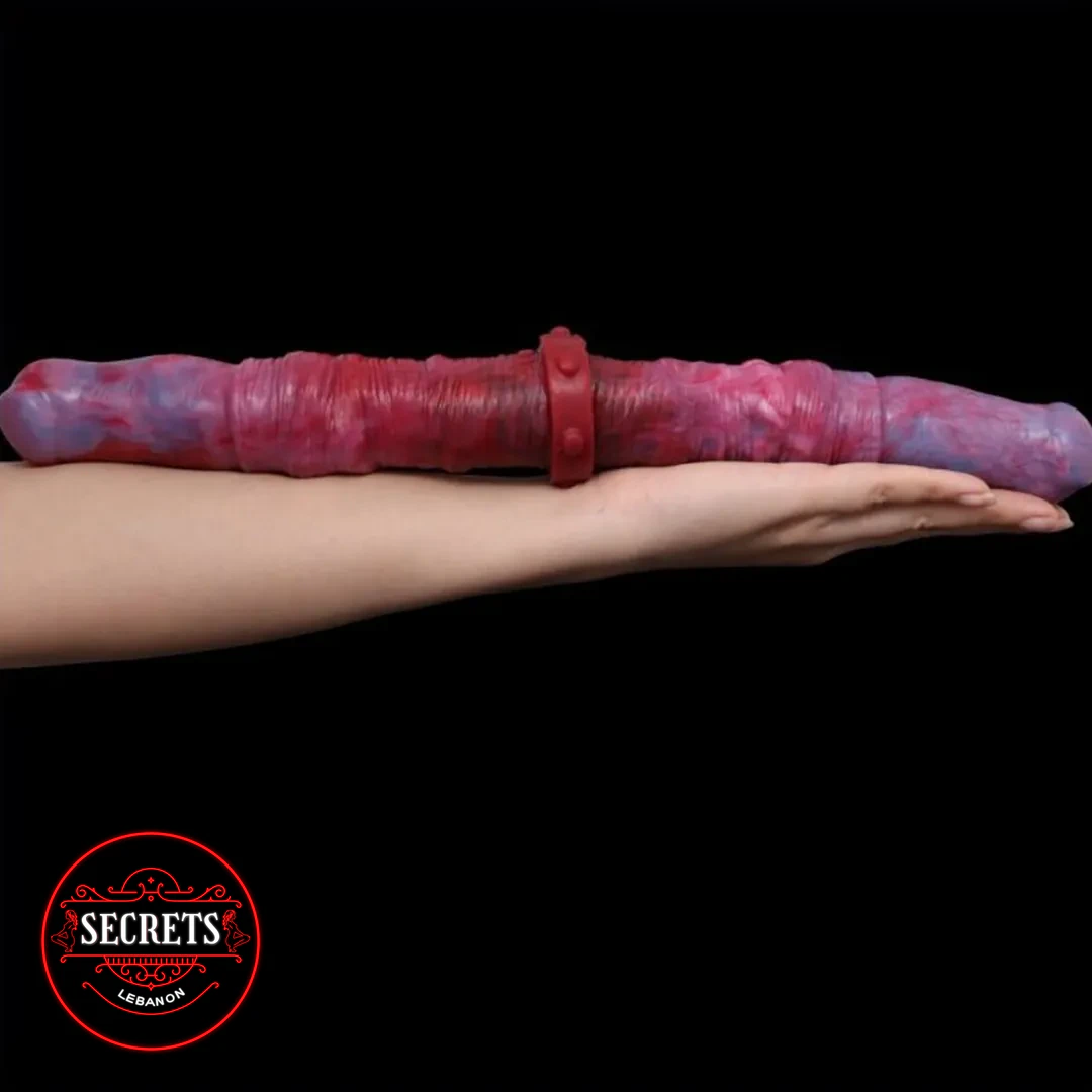 Twisted Swirl Double Ended Dildo in red-blue marble held on outstretched arm