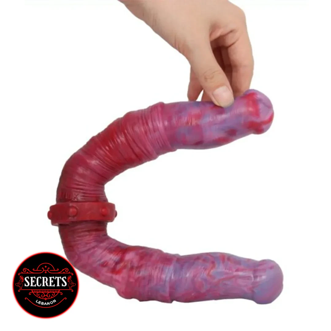 Twisted Swirl Double Ended Dildo in red marbled silicone held by hand