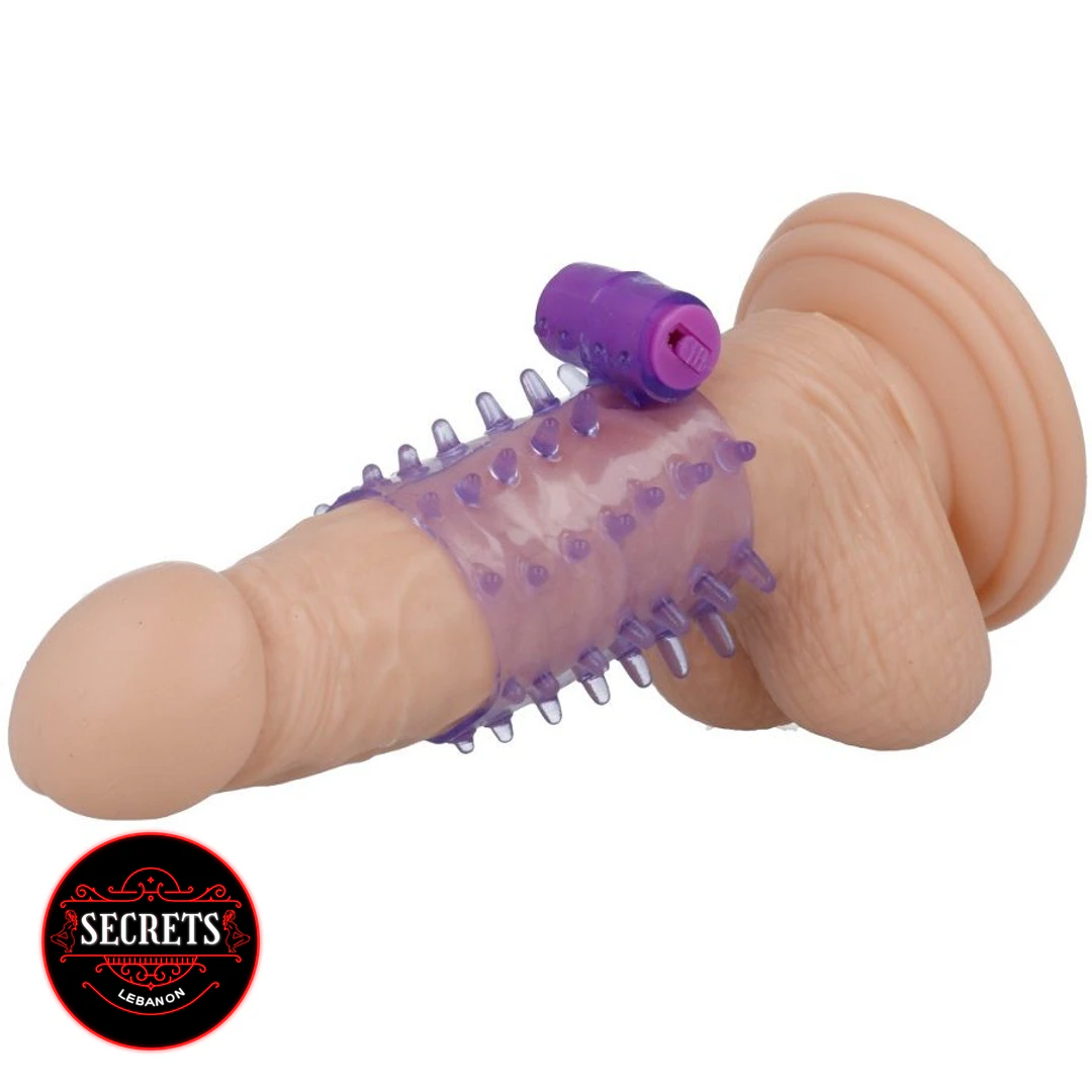 Vibrating Silicone Penis Sleeve in purple with raised nubs on realistic model