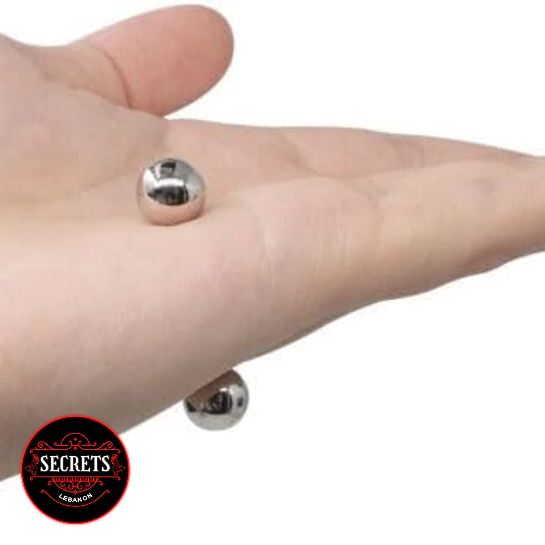2 Pair Magnetic Steel Ball Clamps resting on an open palm