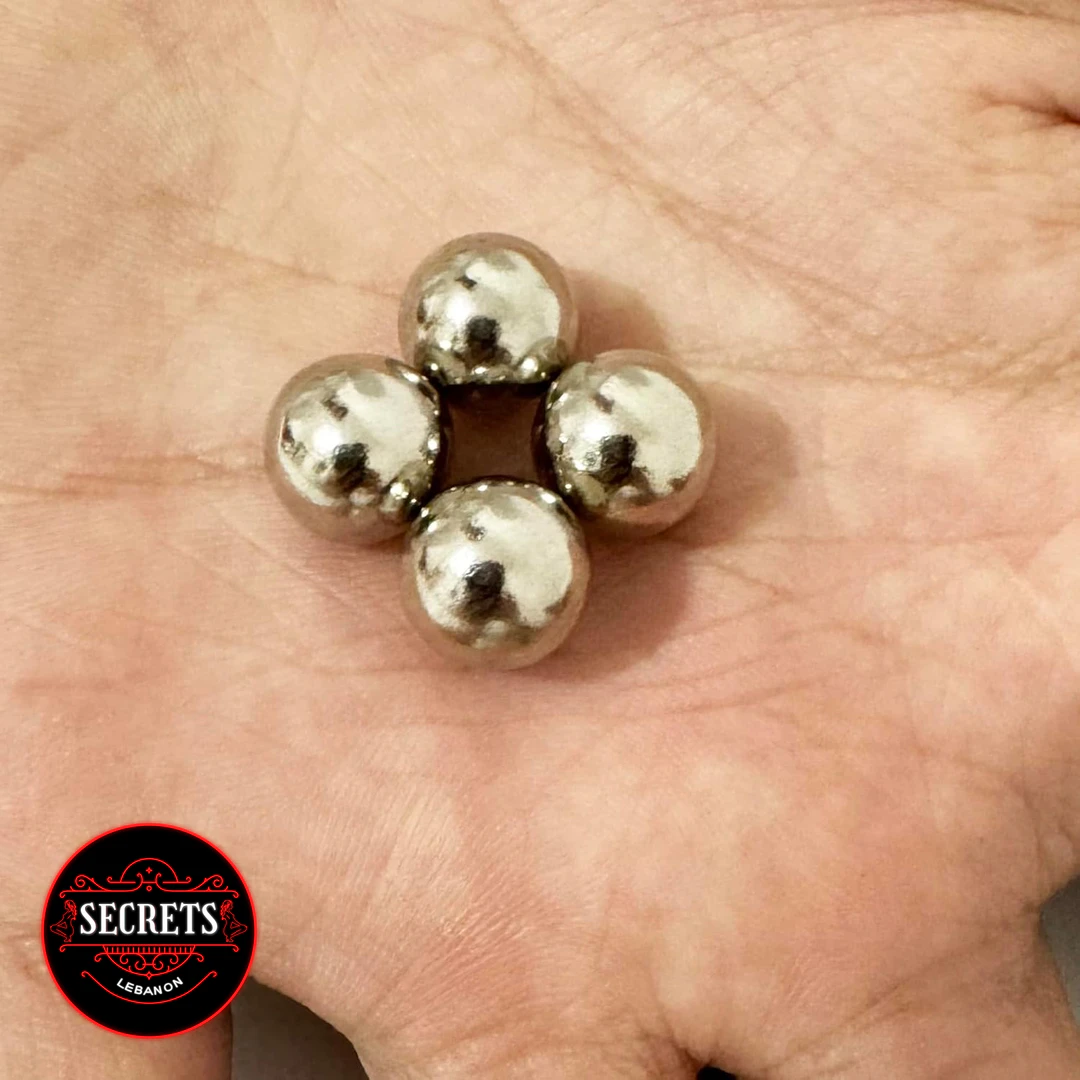 2 Pair Magnetic Steel Ball Clamps resting in open palm showing polished silver finish