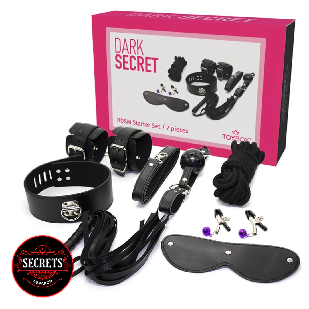 7PieceBeginnersBdsmKit-7 7 Piece Beginners BDSM Kit with black accessories beside pink packaging