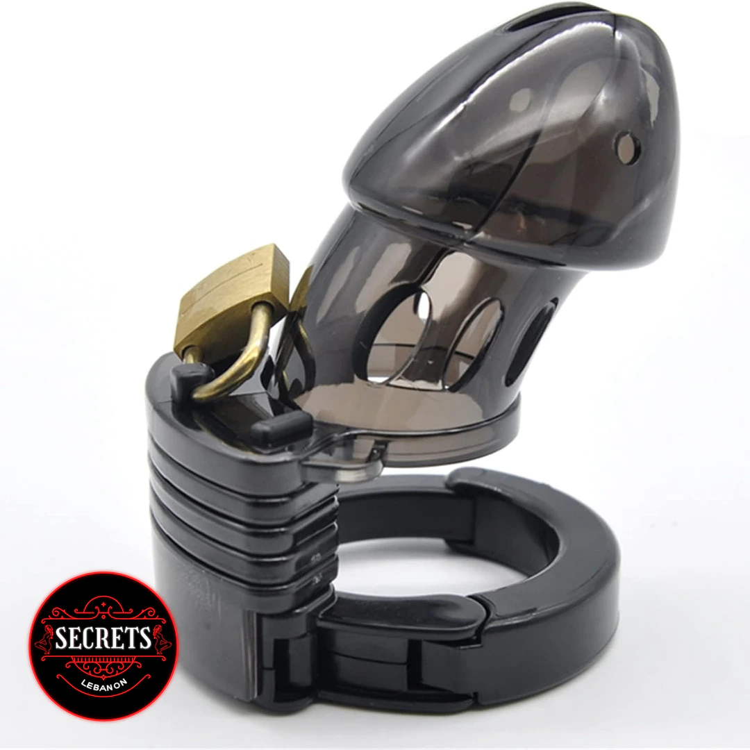 Adjustable Silicone Chastity cage in black with brass padlock on white background