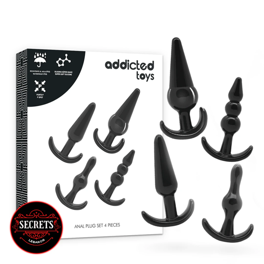 BlackOut 4 Piece Anal Plug Set black silicone plugs beside packaging
