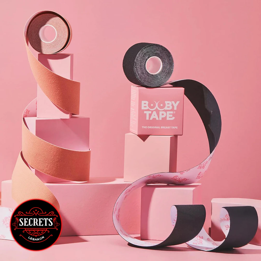 Booby Tape Original Breast Lift Roll in nude and black on pink