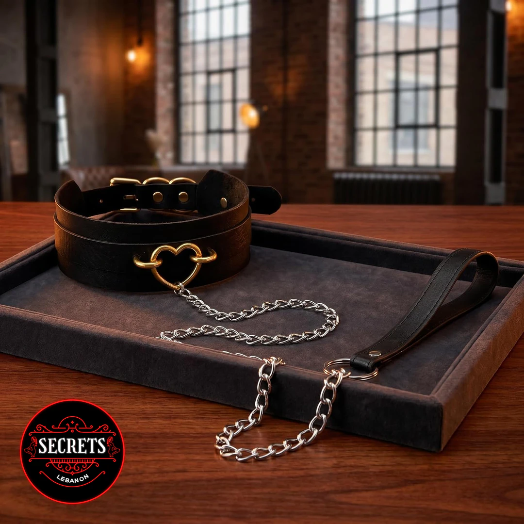 Gold Heart BDSM Collar Leash Set with silver chain on dark velvet tray
