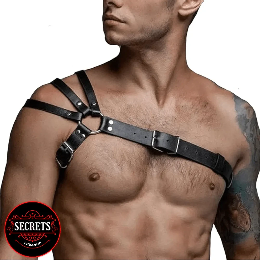 Leather One Shoulder Body Harness with silver buckles on bare male chest