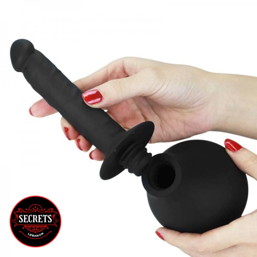 Love Toy Douche Dildo black silicone with detachable bulb base held by hands