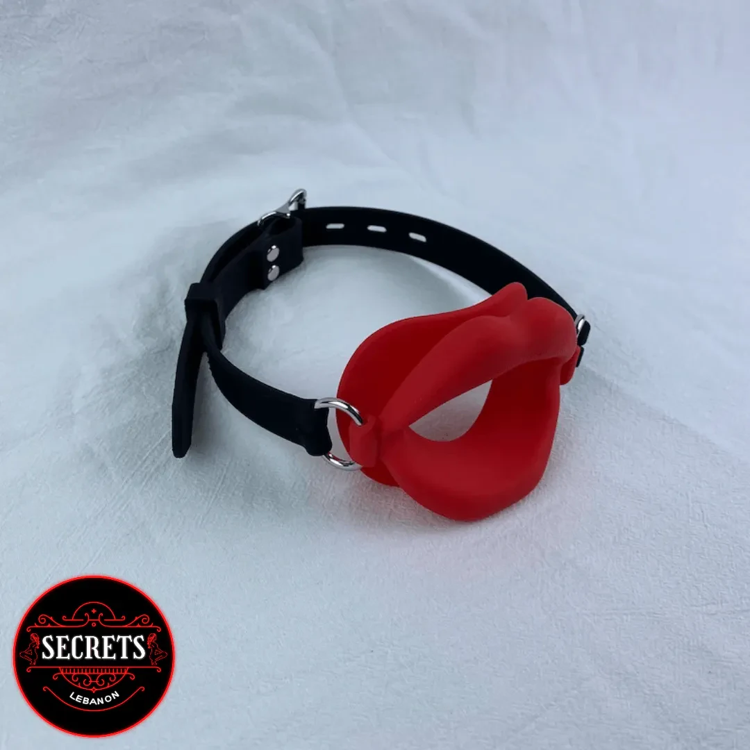 Red Lip Silicone Open Mouth Gag with black adjustable strap, white background