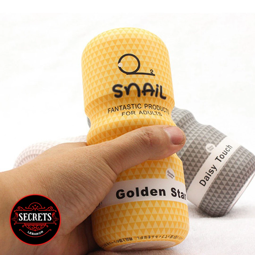 Snail Golden Star Oral Masturbator Cup held in hand yellow textured packaging