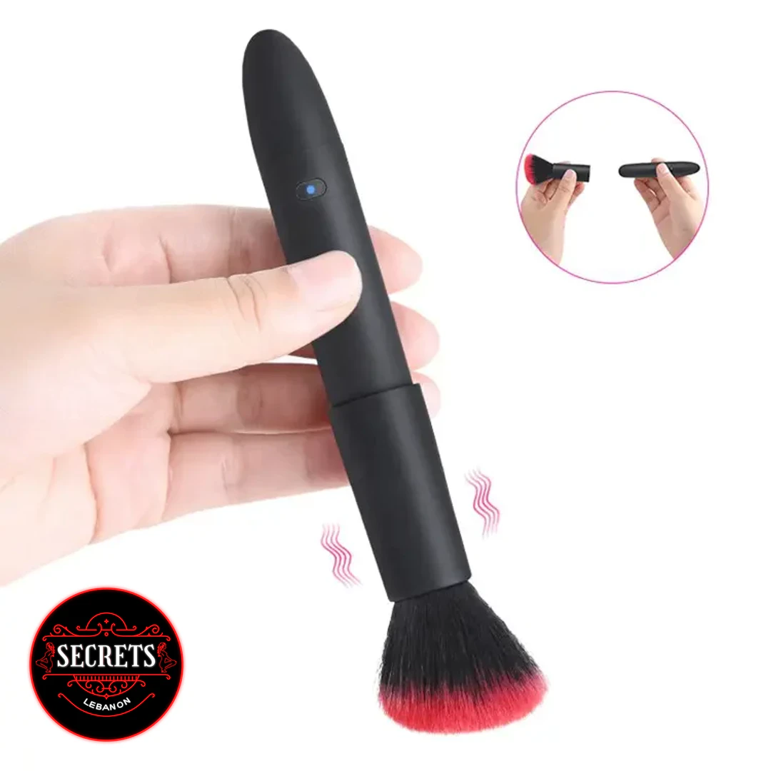 StealthBrush 10 Mode Vibrator held in hand with red-tipped black brush