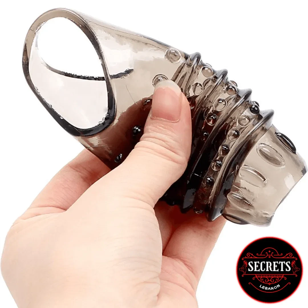 SteelGrip Textured Cock Sleeve held in hand showing smoky grey ribbed design
